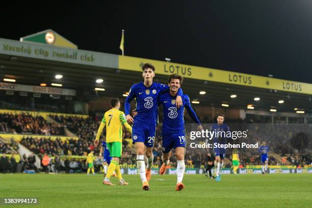 Kai Havertz celebrates with Mason Mount of Chelsea after scoring their team's third goal during the Premier League match between Norwich City and...