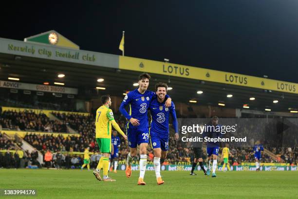 Kai Havertz celebrates with Mason Mount of Chelsea after scoring their team's third goal during the Premier League match between Norwich City and...