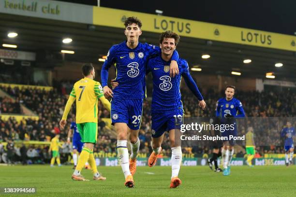 Kai Havertz celebrates with Mason Mount of Chelsea after scoring their team's third goal during the Premier League match between Norwich City and...