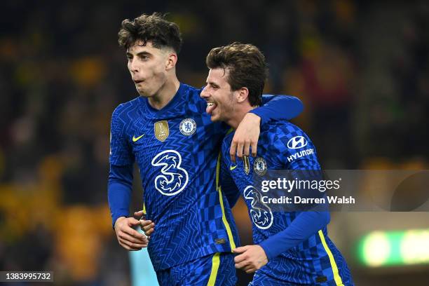 Kai Havertz celebrates with Mason Mount of Chelsea after scoring their team's third goal during the Premier League match between Norwich City and...