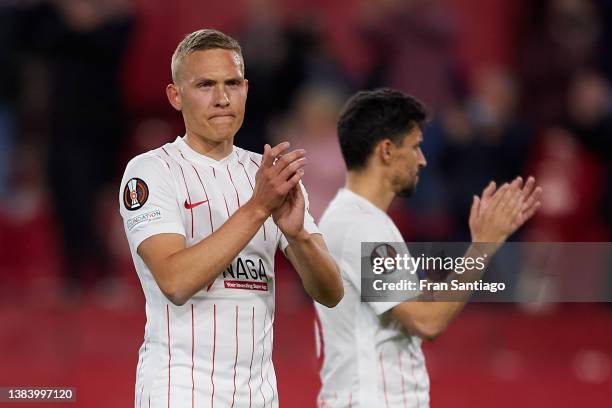 Jesus Navas and Ludwig Augustinsson of Sevilla FC thank for the support during the UEFA Europa League Round of 16 Leg One match between Sevilla FC...