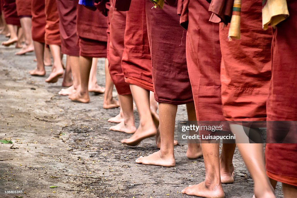 Monks walking in row