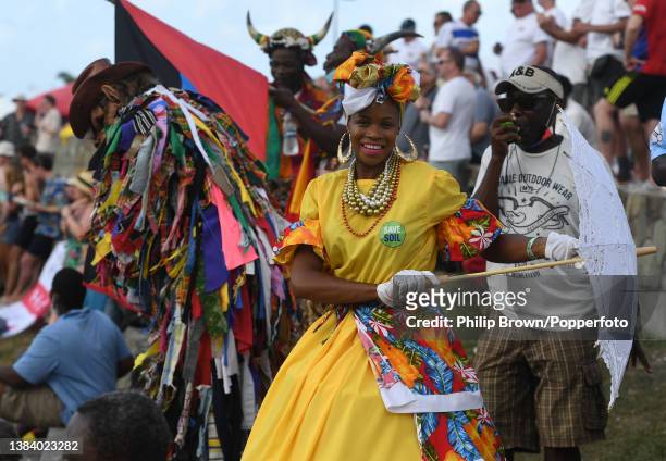 Lady dances in the crowd during the third day of the first Test at Sir Vivian Richards Stadium on March 10, 2022 in Antigua, Antigua and Barbuda.