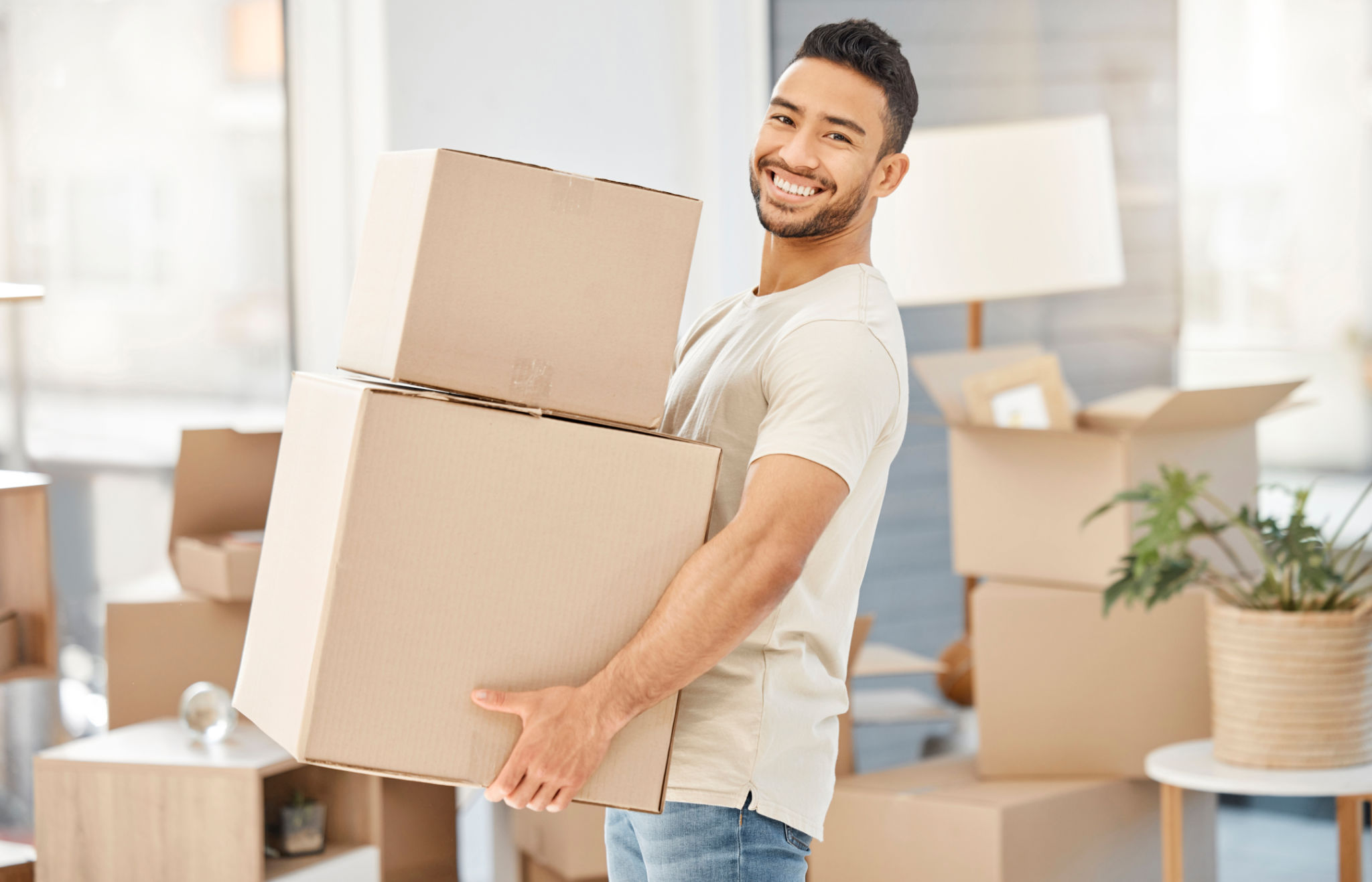 man carrying boxes