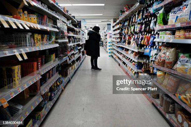 People shop in a store in Brooklyn on March 10, 2022 in New York City. The price of gas, food, cars and other items has hit a 40 year high as...