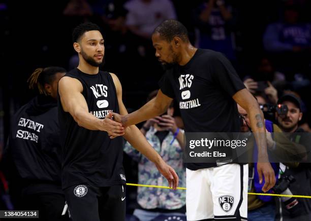 Ben Simmons and Kevin Durant of the Brooklyn Nets greet each other during warm ups before the game against the Philadelphia 76ers at Wells Fargo...