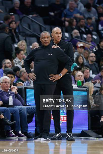 Alvin Gentry head coach of the Sacramento Kings talks to assistant coach Doug Christie in the third quarter against the Denver Nuggets at Golden 1...