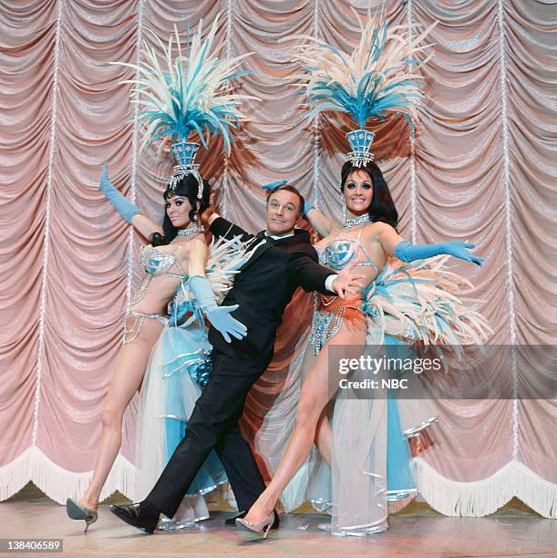 Aired -- Pictured: Gene Kelly with the Folies Bergere Showgirls