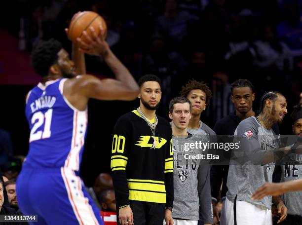 Ben Simmons of the Brooklyn Nets watches as former teammate Joel Embiid of the Philadelphia 76ers takes a shot in the second half at Wells Fargo...