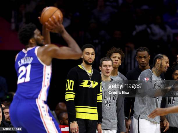 Ben Simmons of the Brooklyn Nets watches as former teammate Joel Embiid of the Philadelphia 76ers takes a shot in the second half at Wells Fargo...