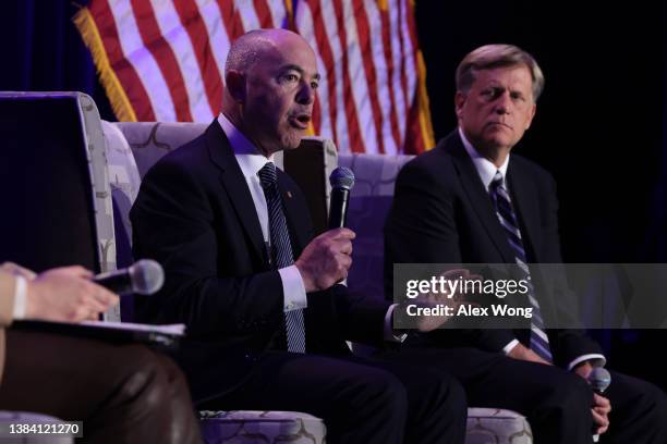 Secretary of Homeland Security Alejandro Mayorkas speaks as former U.S. Ambassador to Russia Michael McFaul listens during a panel discussion at a...