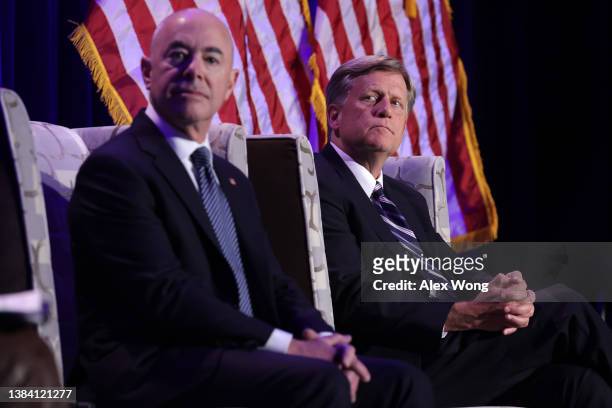Secretary of Homeland Security Alejandro Mayorkas and former U.S. Ambassador to Russia Michael McFaul listen during a panel discussion at a dinner of...