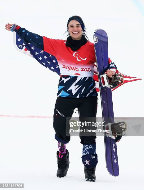 Gold medallist Brenna Huckaby of Team United States celebrates after competing in the Women's Banked Slalom Snowboard SB-LL2 during day seven of the...