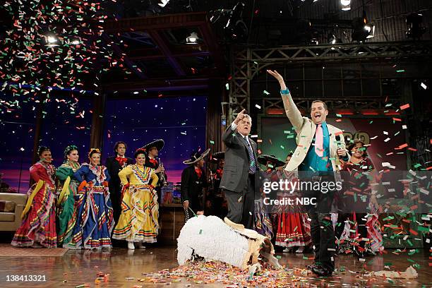 Air Date -- Episode 3757 -- Pictured: Host Jay Leno and Ross 'The Intern' Matthews celebrate Cinco de Mayo with dancers onstage May 5, 2009