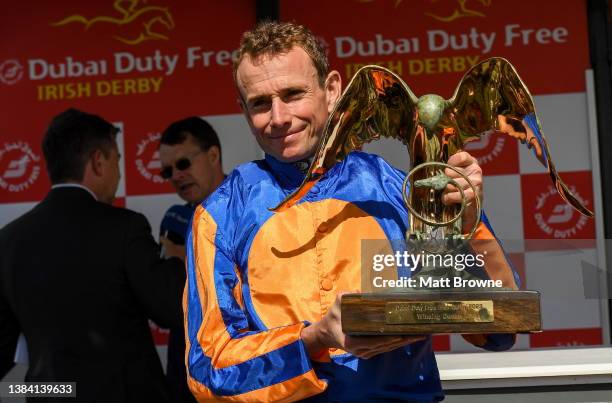 Kildare , Ireland - 2 July 2023; Jockey Ryan Moore celebrates with the trophy after winning the Dubai Duty Free Irish Derby on Auguste Rodin during...