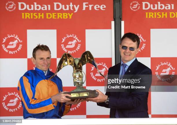 Kildare , Ireland - 2 July 2023; Jockey Ryan Moore and trainer Aidan O'Brien celebrate with the trophy after winning the Dubai Duty Free Irish Derby...