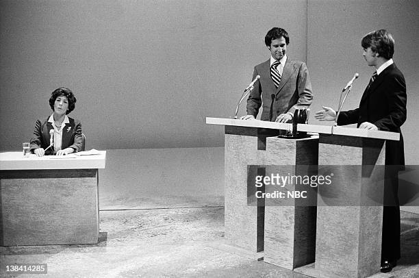 Episode 1 -- Air Date -- Pictured: Lily Tomlin as Ruth Clusen, Chevy Chase as Gerald Ford, Dan Aykroyd as Jimmy Carter during the "Debate '76" skit...