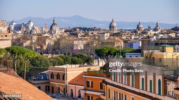 a suggestive cityscape of the historic heart of rome seen from a terrace in the prati district - vatican city aerial stock pictures, royalty-free photos & images