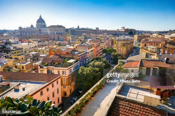 the heart of rome seen from a terrace in the prati district with the dome of st. peter's basilica on the horizon - rome italië stockfoto's en -beelden