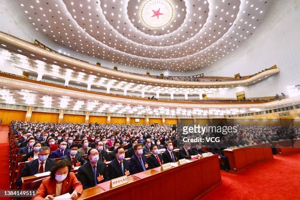 Deputies attend the closing meeting of the fifth session of the 13th National People's Congress at the Great Hall of the People on March 11, 2022 in...