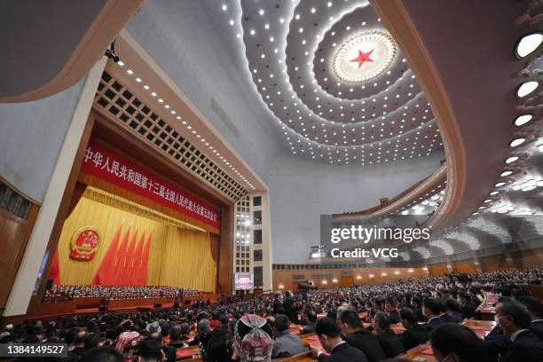 Deputies attend the closing meeting of the fifth session of the 13th National People's Congress at the Great Hall of the People on March 11, 2022 in...