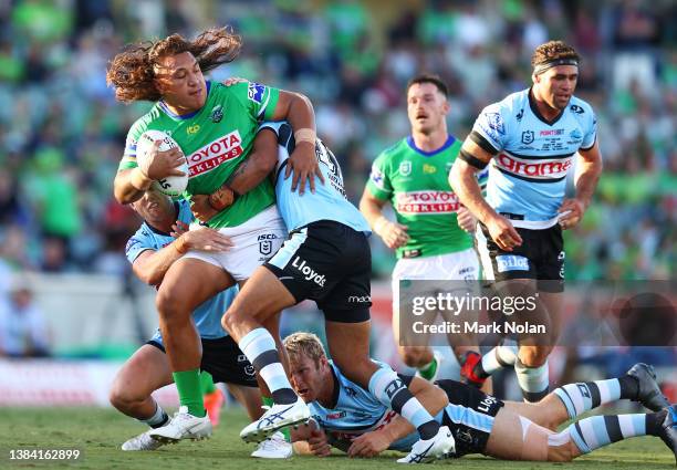 Josh Papalii of the Raiders runs the ball during the round one NRL match between the Canberra Raiders and the Cronulla Sharks at GIO Stadium, on...