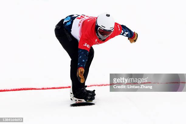 Evan Strong of Team United States competes in the Men's Banked Slalom Snowboard SB-LL2 during day seven of the Beijing 2022 Winter Paralympics at...