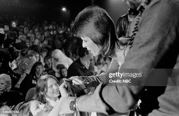 The 1980 Floor Show staring David Bowie" Episode 210 -- Aired: 11/16/73 -- Pictured: David Bowie signs autographs for fans during his last show as...