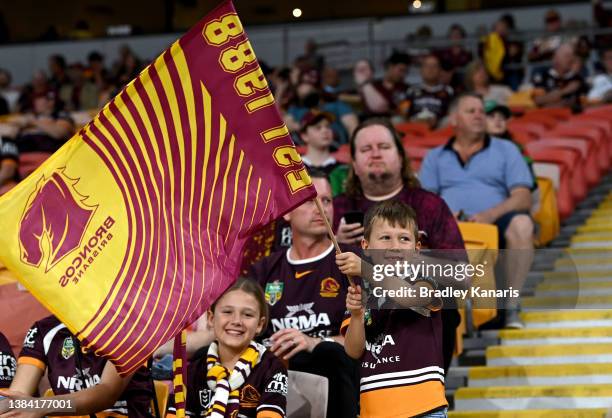 Young Broncos fan shows his support during the round one NRL match between the Brisbane Broncos and the South Sydney Rabbitohs at Suncorp Stadium, on...