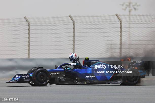 Nicholas Latifi of Canada and Williams climbs from his car as his rear brakes catch fire during Day Two of F1 Testing at Bahrain International...