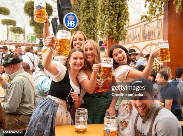 beer tent, octoberfest in munich, germany - münchen stockfoto's en -beelden