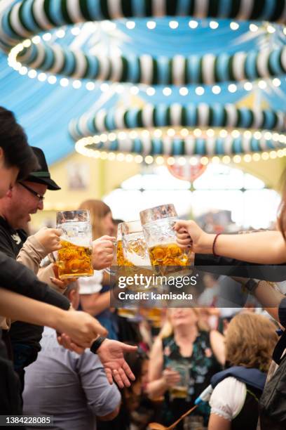 beer tent, octoberfest in munich, germany - theresienwiese stock pictures, royalty-free photos & images