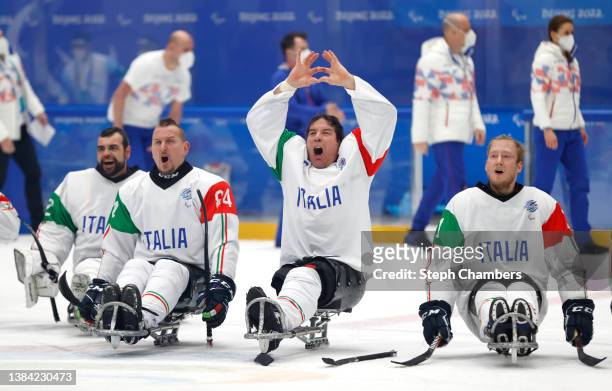 Gian Luca Cavaliere of Team Italy celebrates victory with his teammates following the Para Ice Hockey 5th v 6th Match between Czech Republic and...