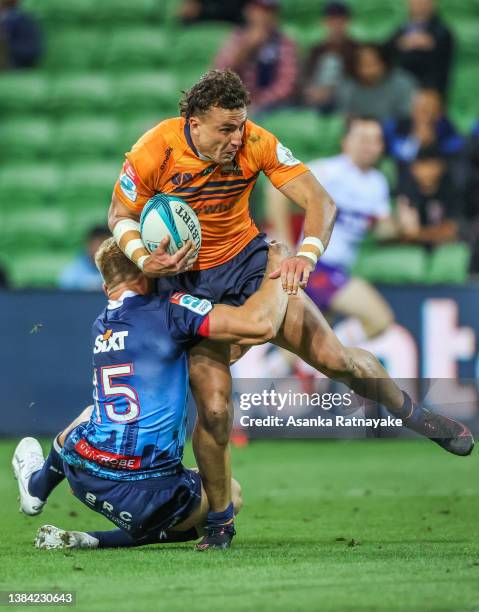 Tom Banks of the Brumbies scores a try as he is tackled by Reece Hodge of the Rebels during the round four Super Rugby Pacific match between the...
