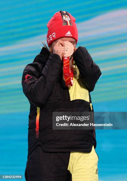 Bronze medalist Andrea Rothfuss of Team Germany celebrates on the podium during the medal ceremony for the Women's Giant Slalom Standing on day seven...
