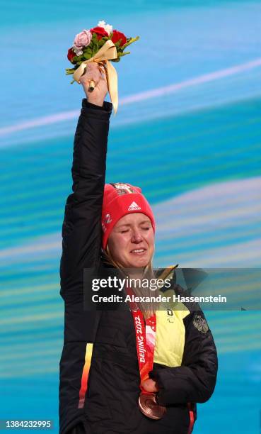 Bronze medalist Andrea Rothfuss of Team Germany celebrates on the podium during the medal ceremony for the Women's Giant Slalom Standing on day seven...