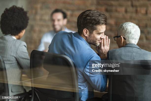 whispering on a job interview! - mystery stockfoto's en -beelden
