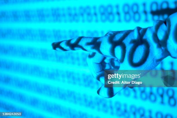 someone points with his index finger virtually. binary code in the background. - robotic process automation concept stock pictures, royalty-free photos & images