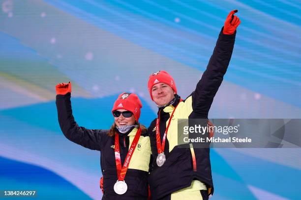 Silver medalist Linn Kazmaier of Team Germany celebrates with her guide on the podium during the medal ceremony for the Women’s Individual Vision...