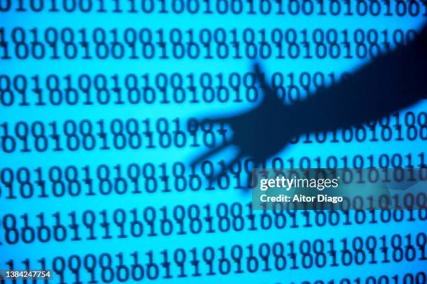 a human hand over binary code. - código de segurança - fotografias e filmes do acervo