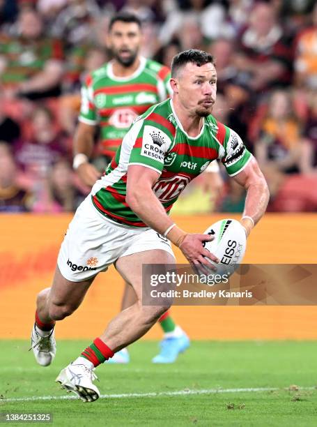 Damien Cook of the Rabbitohs runs with the ball during the round one NRL match between the Brisbane Broncos and the South Sydney Rabbitohs at Suncorp...