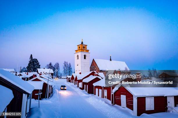 car traveling on icy road at dusk, gammelstad, sweden - lulea - fotografias e filmes do acervo