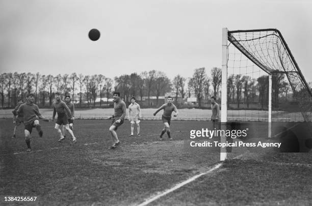 Soccer players of the Plymouth Argyle FC team in training, UK, January 1924; they are Albert Fishwick, Jimmy Dickinson, Percy Cherrett, Fred...