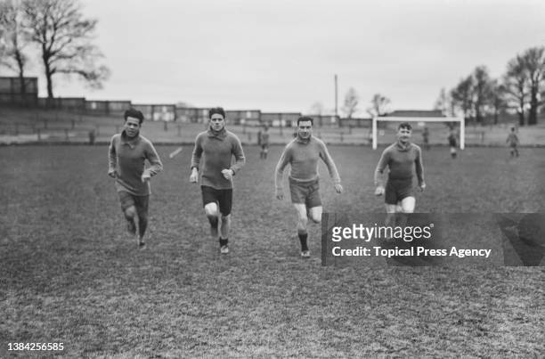 Soccer players of the Plymouth Argyle FC team in training, UK, January 1924; they are Jack Leslie, Percy Cherrett, Bob Preston, Jimmy Dickinson.