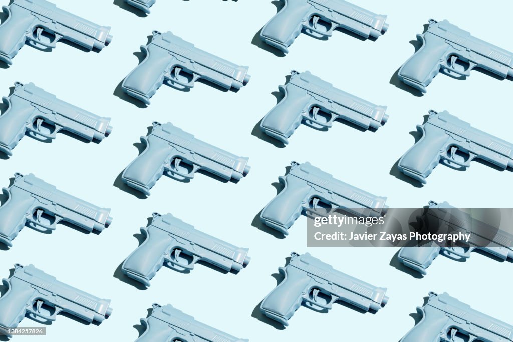 Blue Handgun On Blue Background