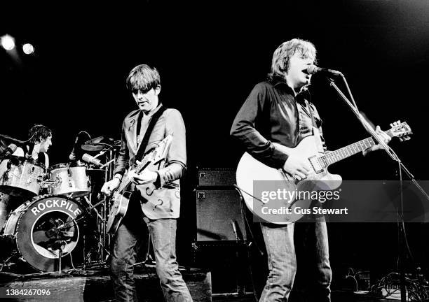 Terry Williams, Nick Lowe and Dave Edmunds of Rockpile perform on stage at the Roundhouse, London, England, on October 17, 1978.