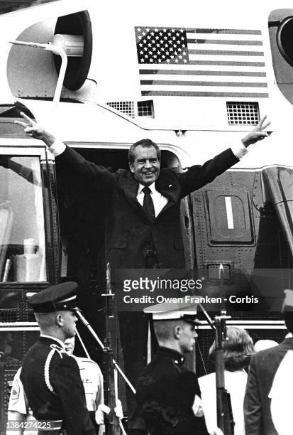 Richard Nixon, waves goodbye, as he departs in the Presidential Helicopter from the South Lawn of the White House on the day of his resignation.