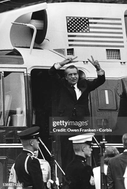 Richard Nixon, waves goodbye, as he departs in the Presidential Helicopter from the South Lawn of the White House on the day of his resignation.