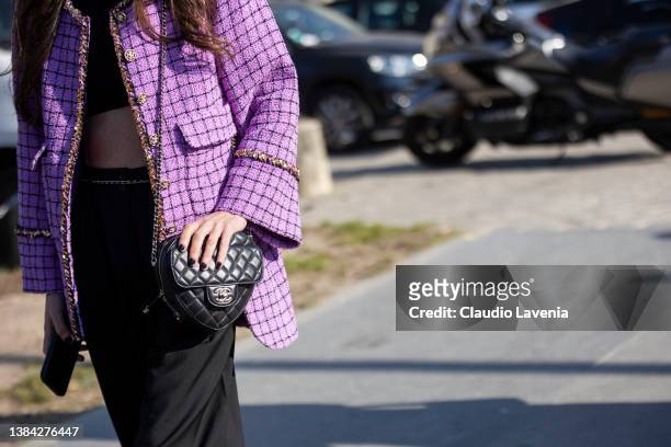 Chloe Harrouche aka Loulou De Saison wearing a black crop top, black pants, purple tweed checked jacket and black Chanel bag, is seen outside Chanel,...