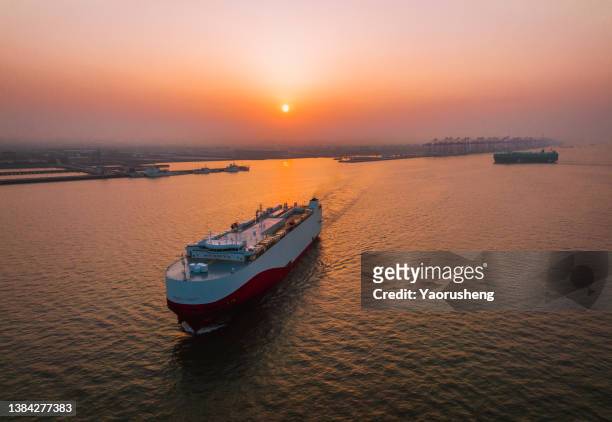 aerial view of one large roro (roll on/off) carrier vessels  depature from shanghai waigaoqiao port with exported cars and fork machines - china ship bildbanksfoton och bilder